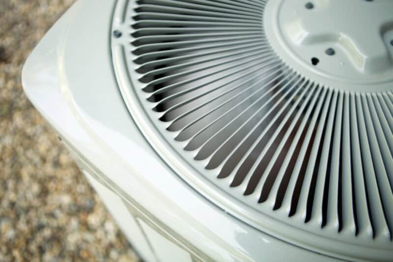 closeup of an air conditioning unit that has been turned on
