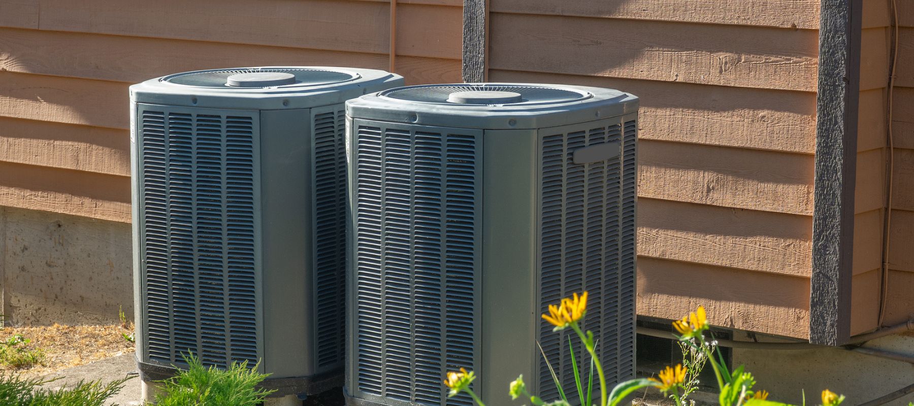 closeup of heat pumps outside of a residential home